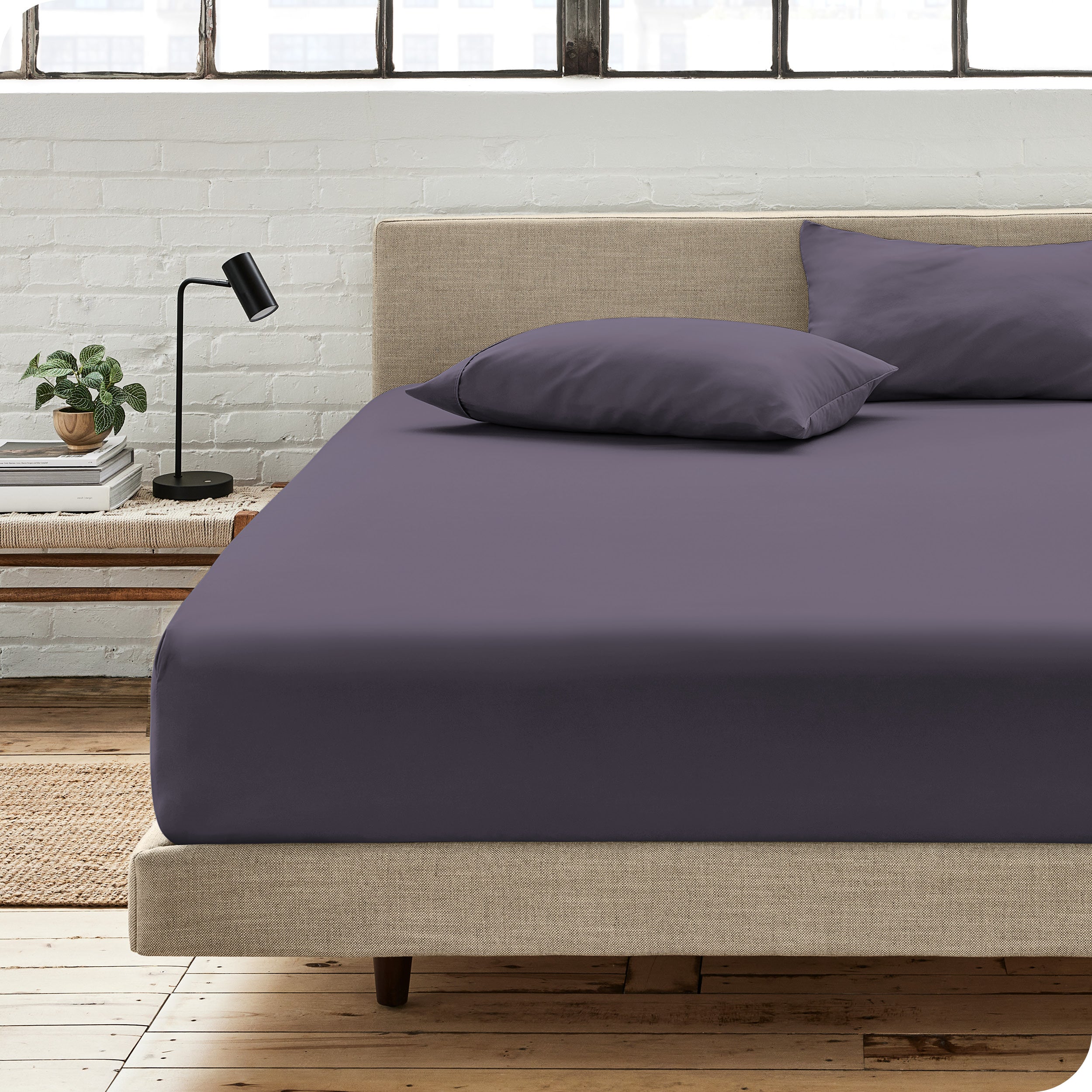 An organic cotton fitted sheet on a mattress