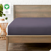 An organic percale bottom sheet on a mattress