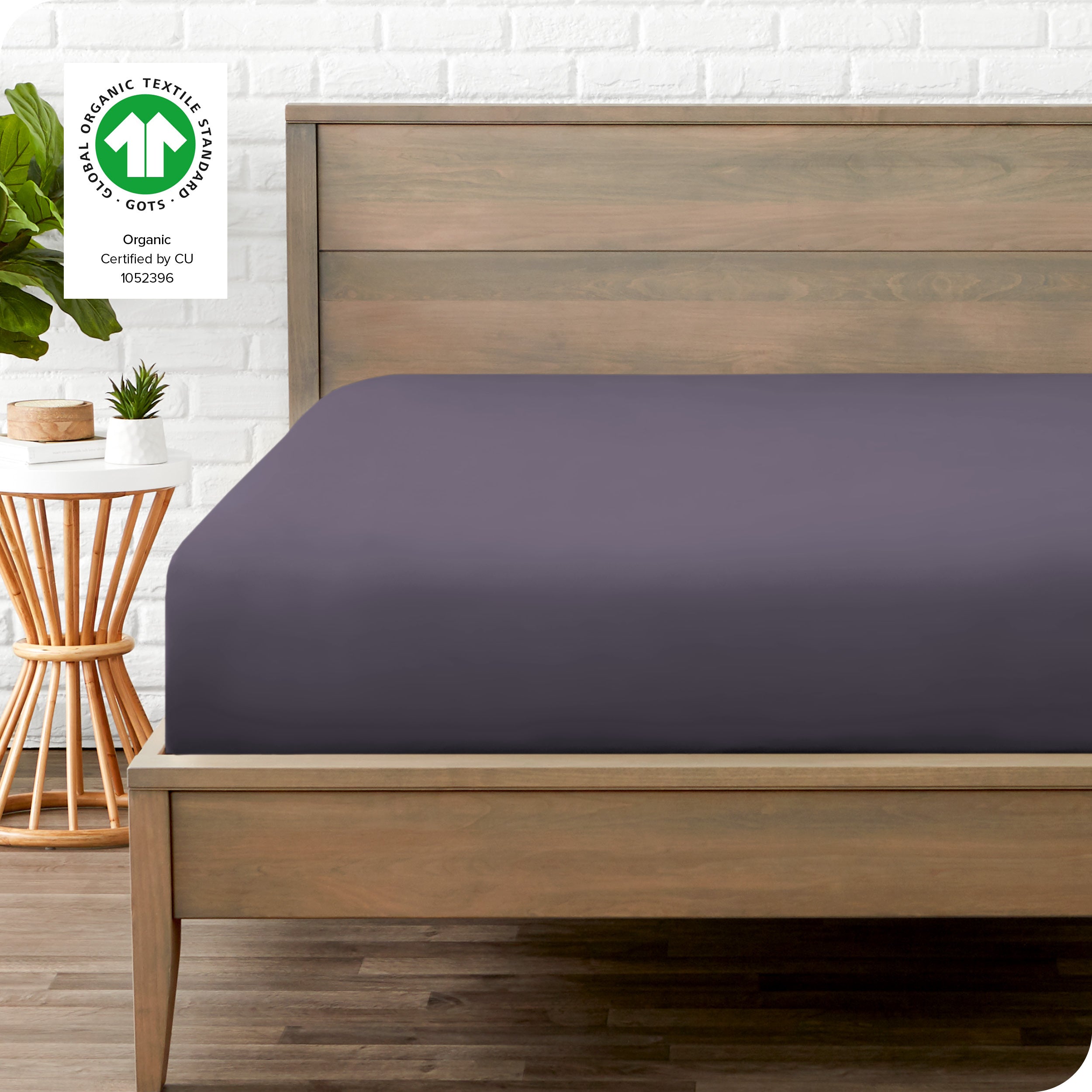 An organic percale bottom sheet on a mattress