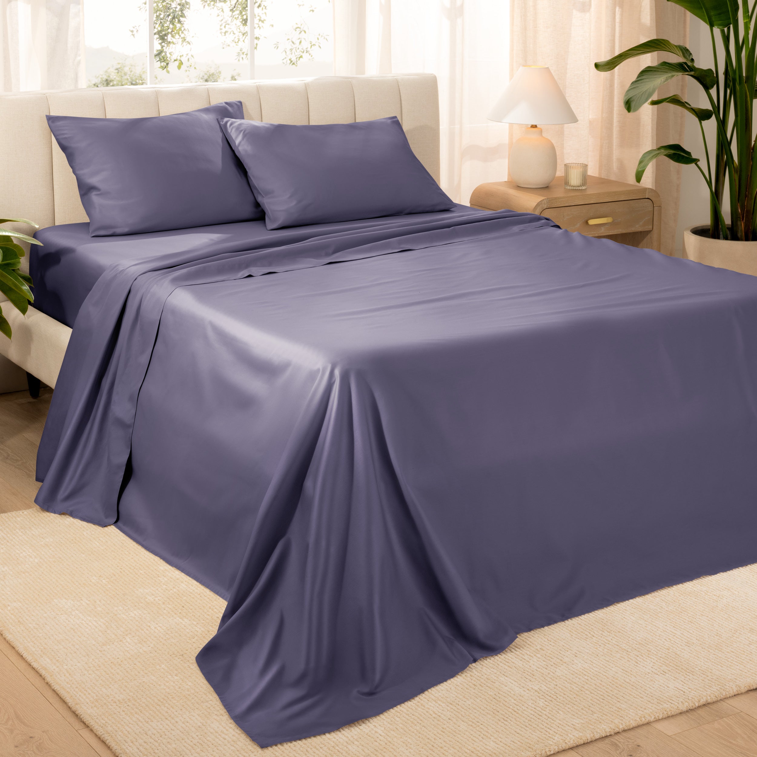 Diagonal view of a decorated room scene with sateen sheets