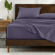 Percale sheets on bed in a modern bedroom