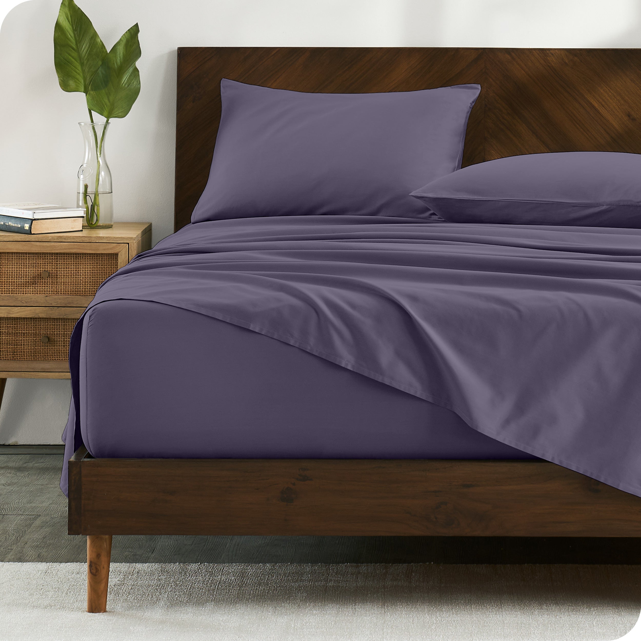 Percale sheets on bed in a modern bedroom