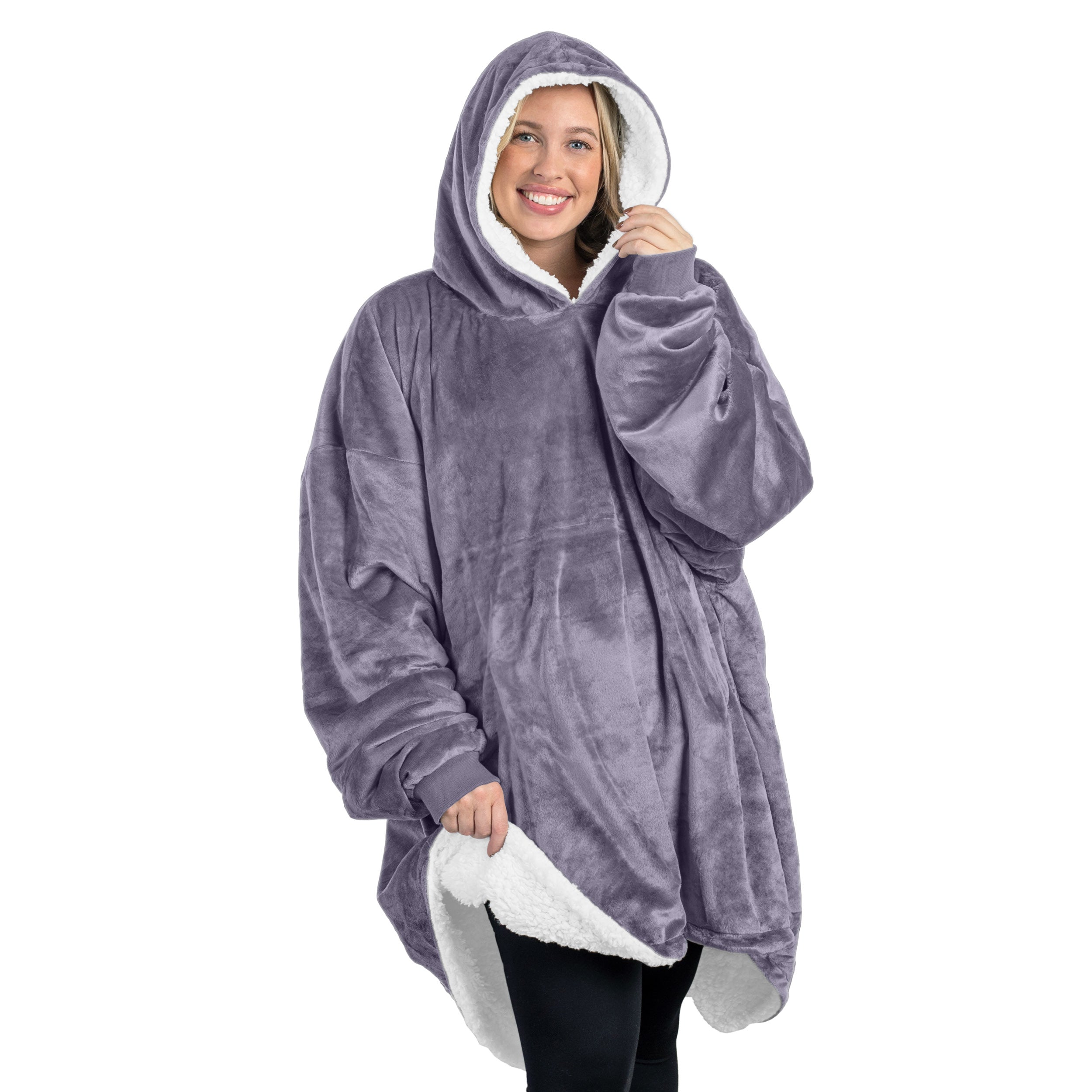 An adult with a sherpa wearable blanket on