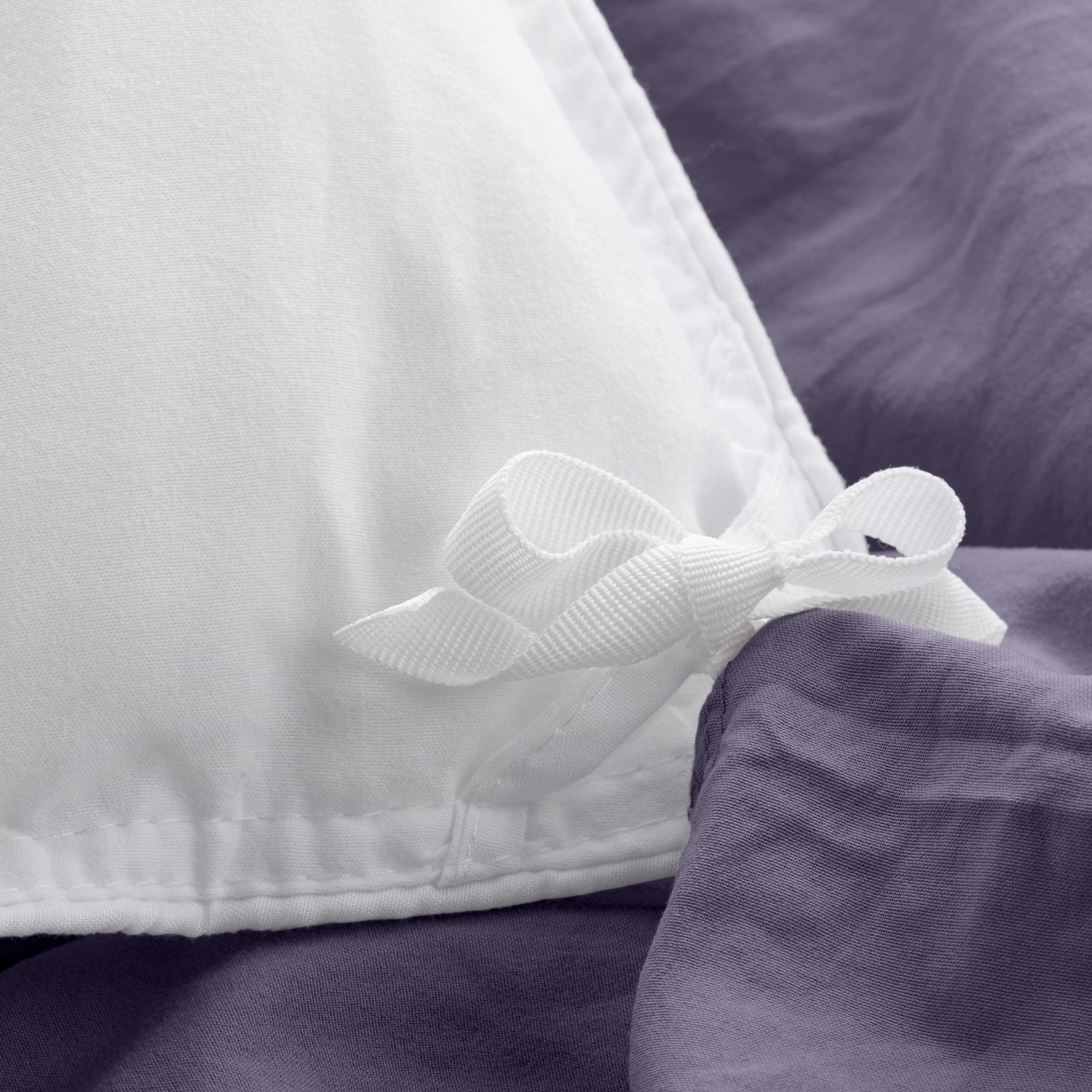 Close up of cloth ties for attaching duvet insert to inside of duvet cover