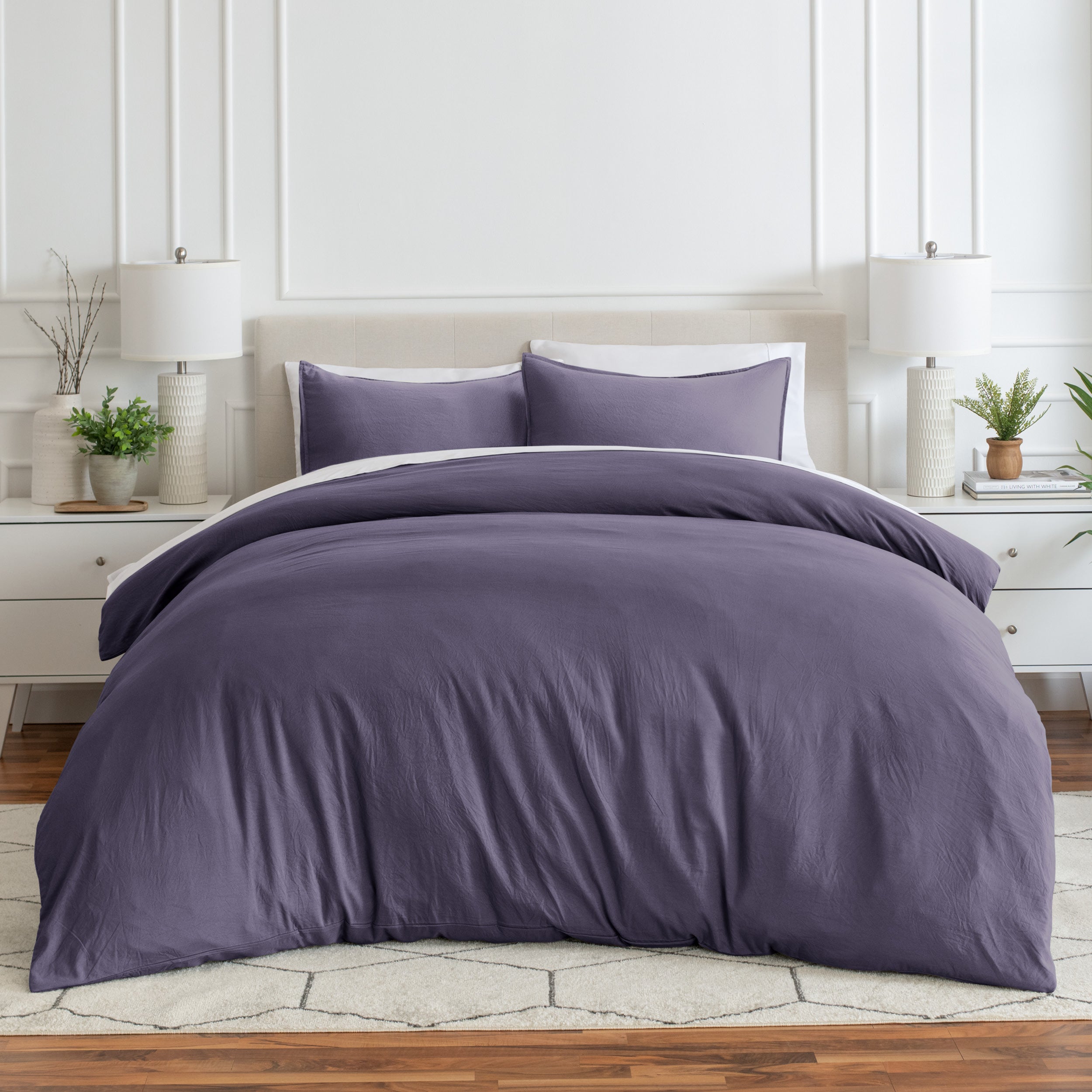Relaxing room scene with a duvet cover laid out over the bed