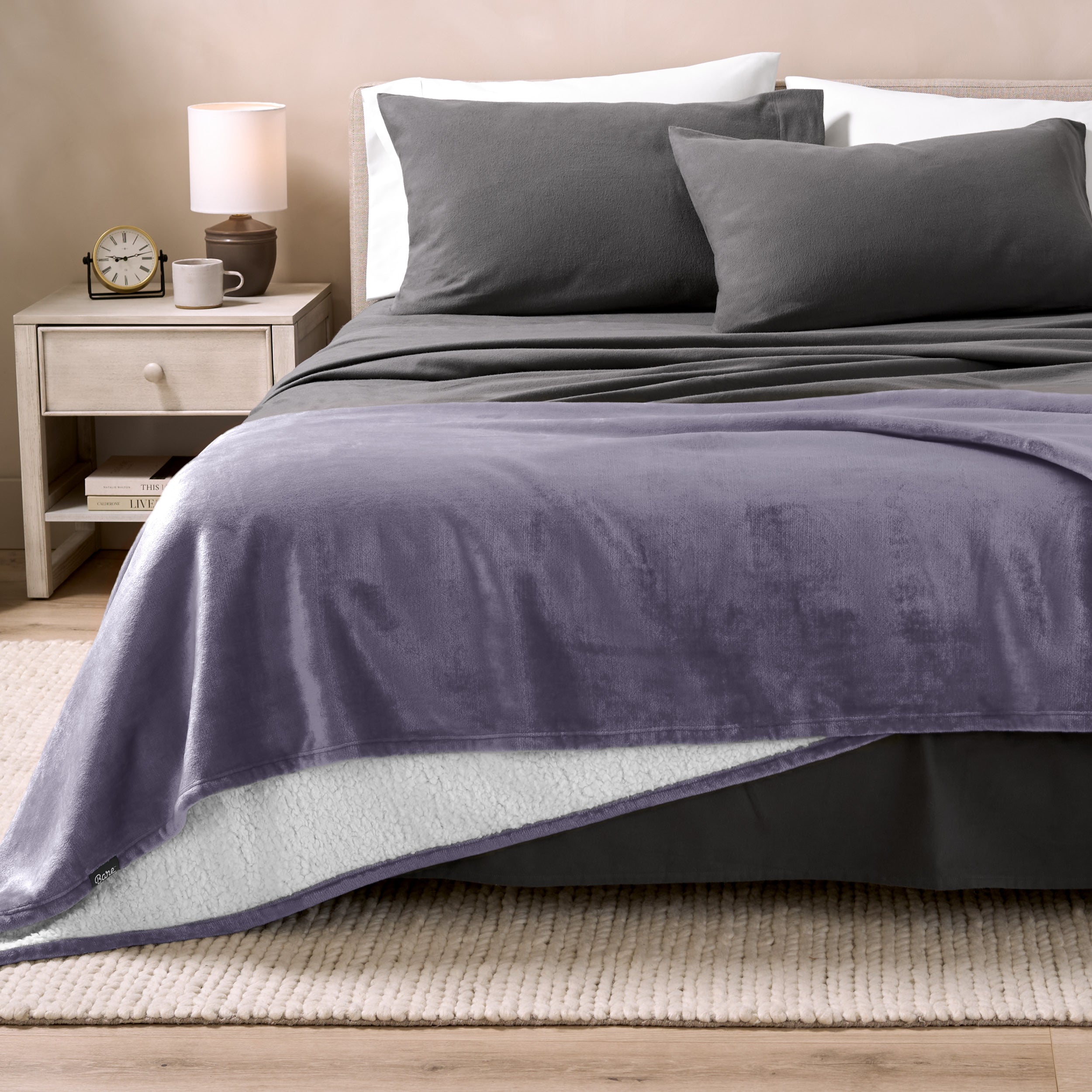 Sherpa Blanket laying on a bed folded over itself part way