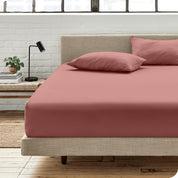 An organic cotton fitted sheet on a mattress