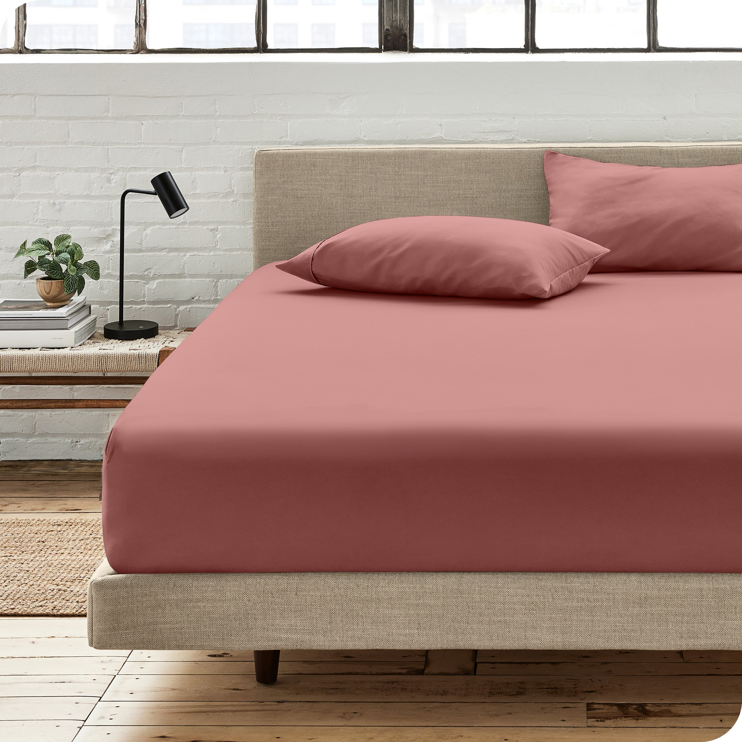 An organic cotton fitted sheet on a mattress