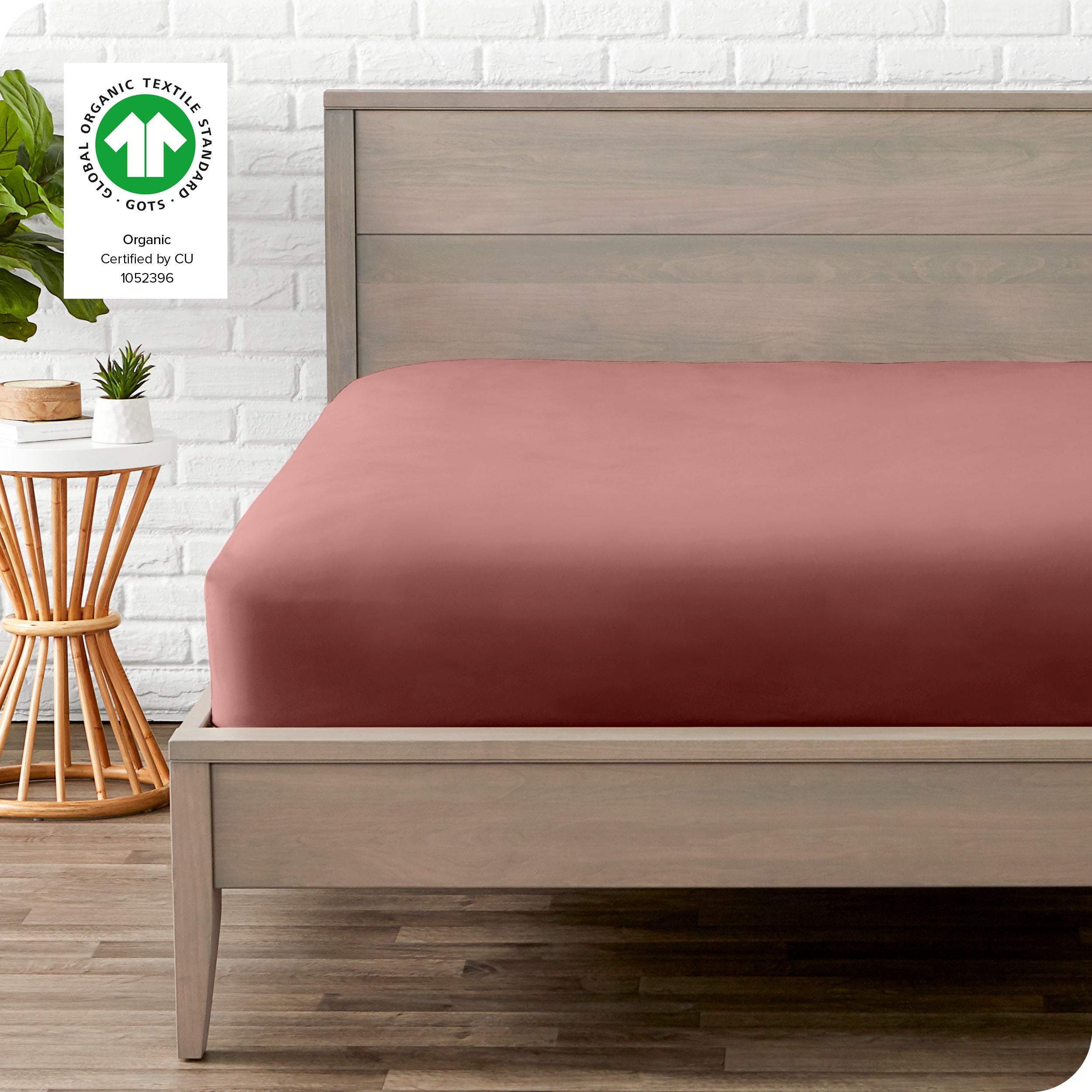 An organic percale bottom sheet on a mattress