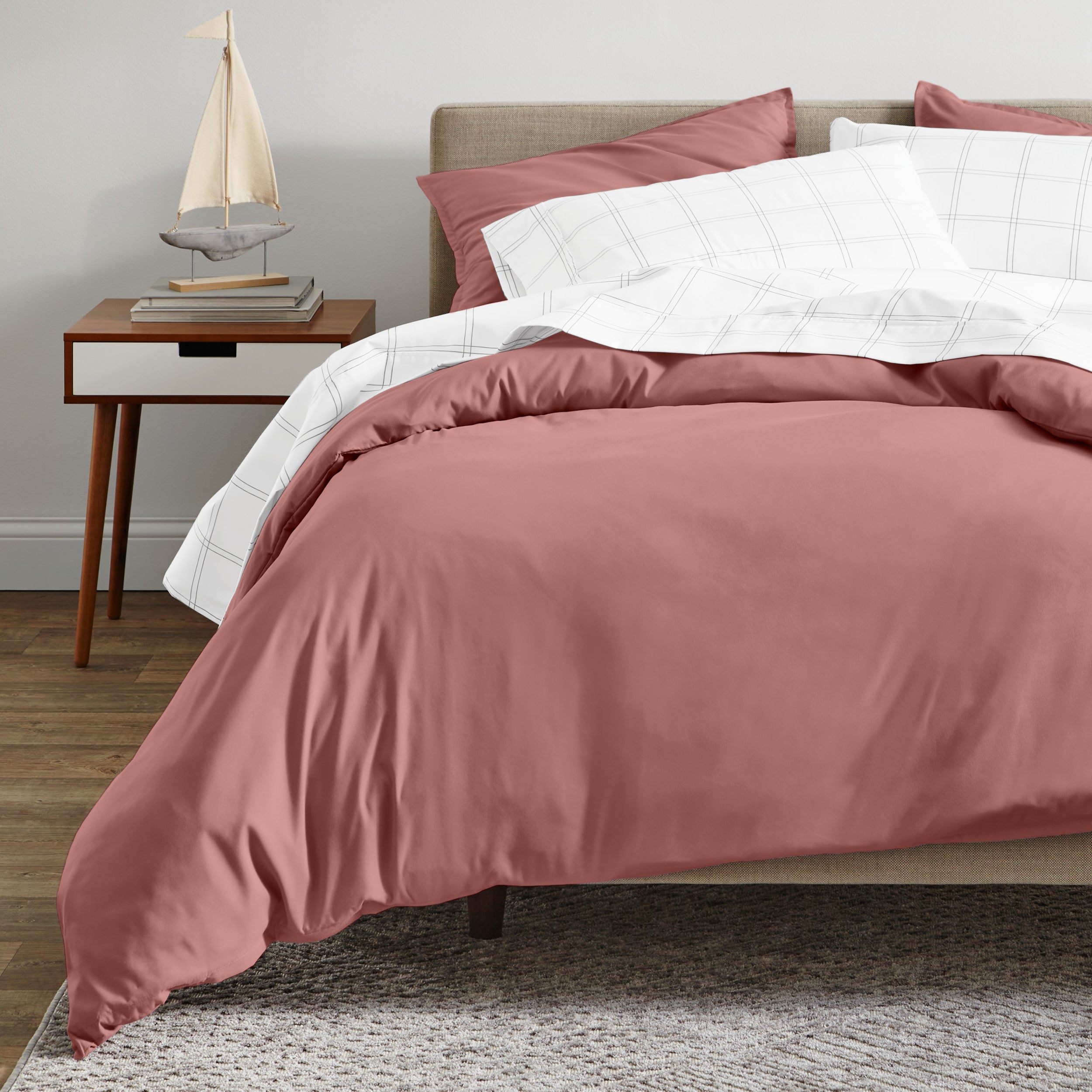 A modern bed with a organic sateen duvet cover set on.