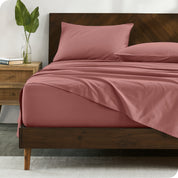 Percale sheets on bed in a modern bedroom