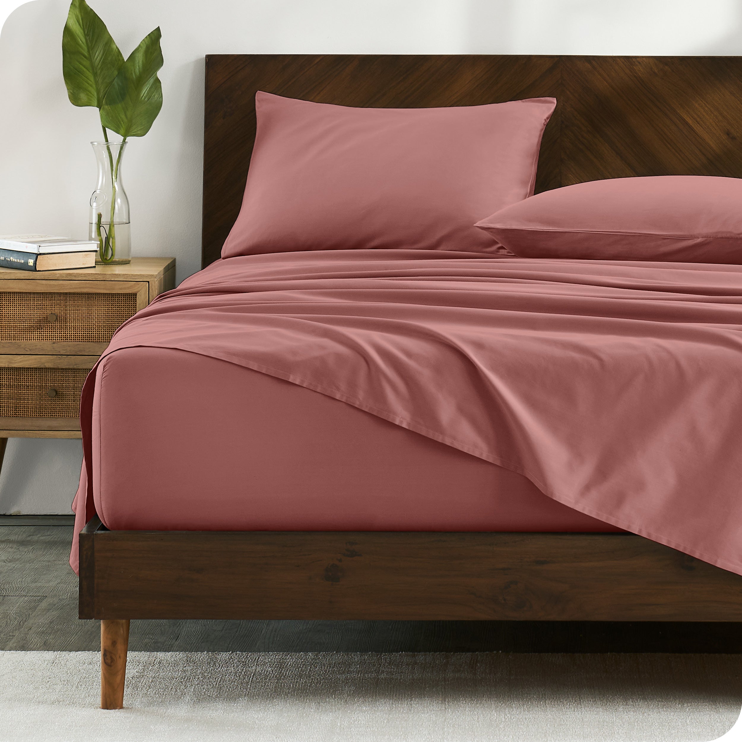 Percale sheets on bed in a modern bedroom