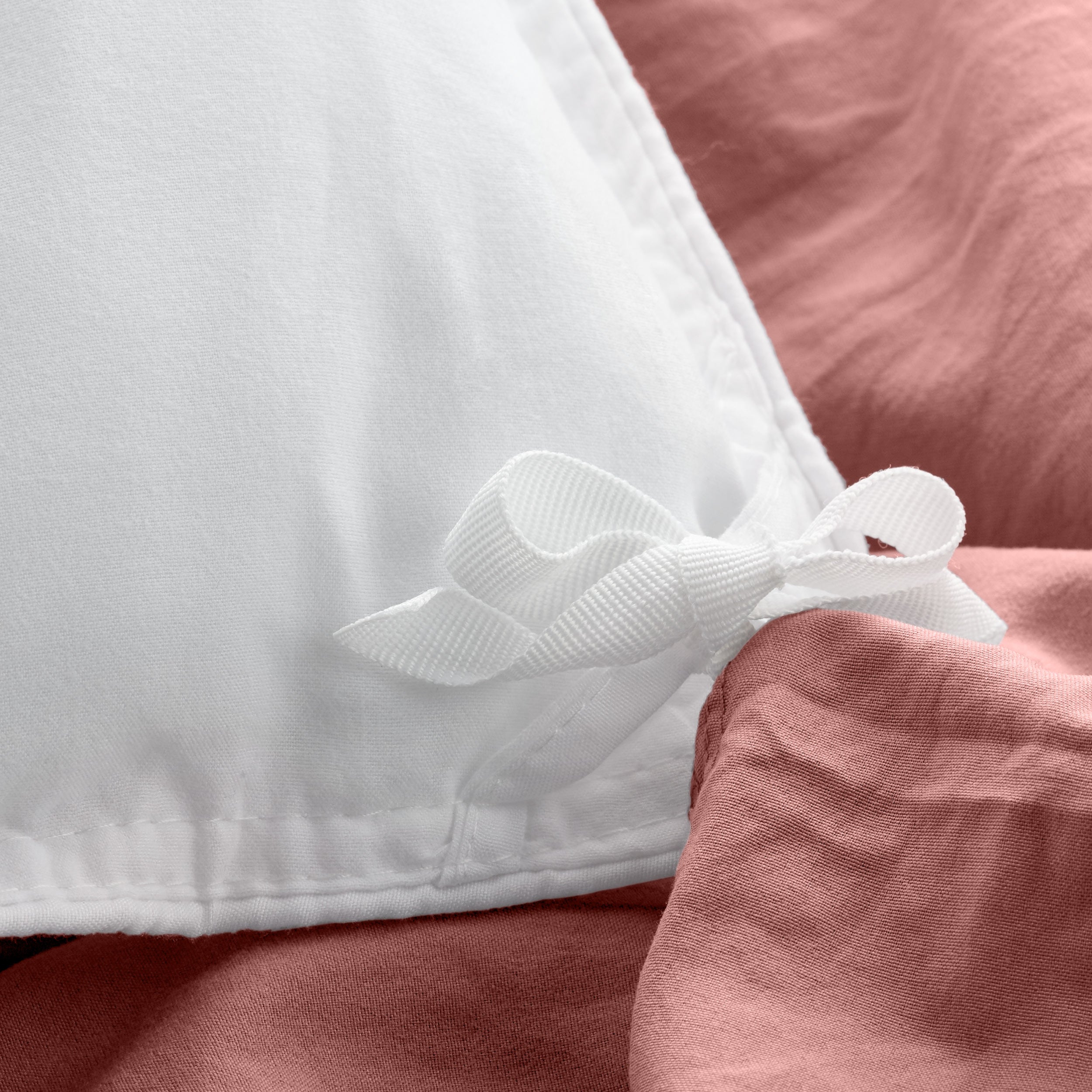 Close up of cloth ties for attaching duvet insert to inside of duvet cover
