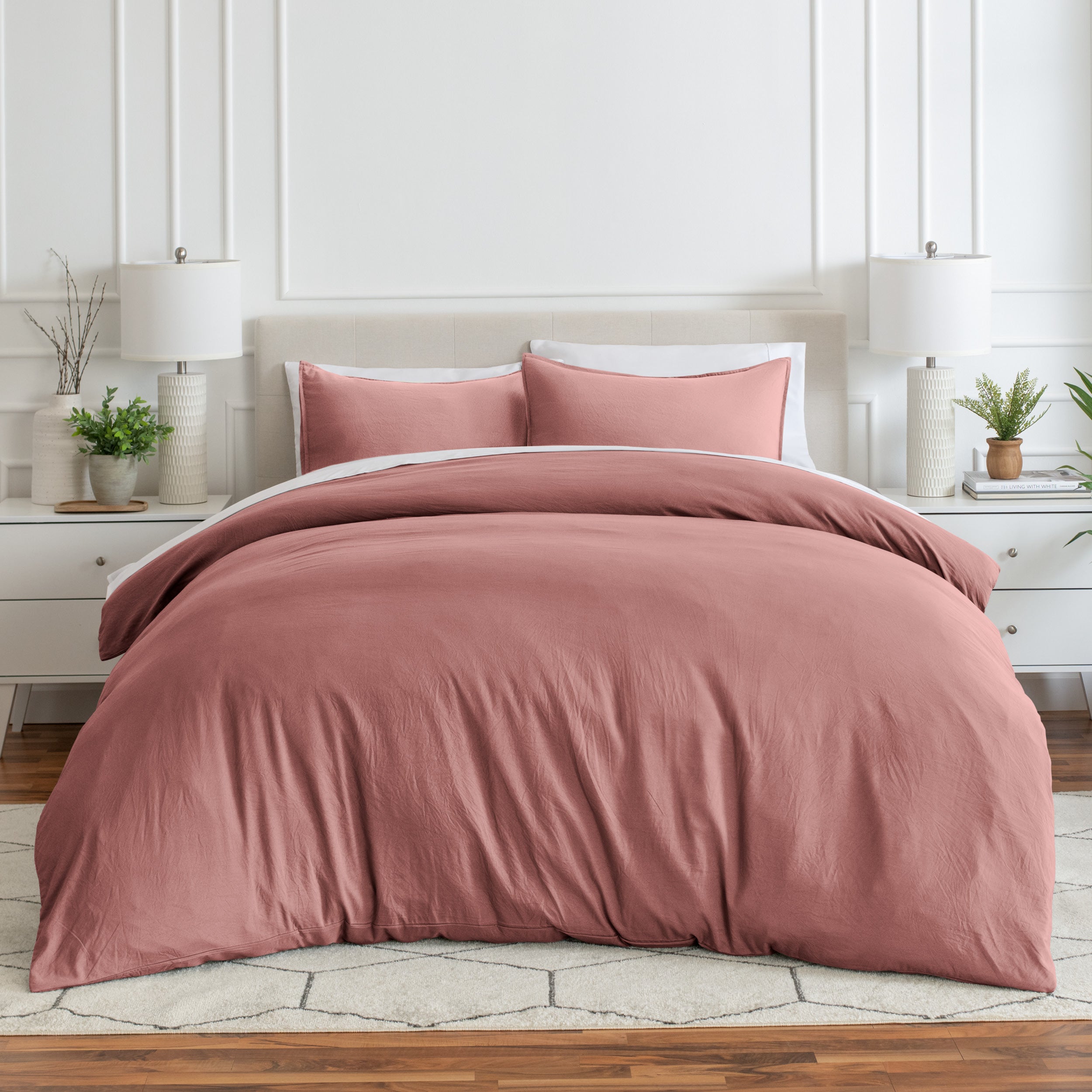 Relaxing room scene with a duvet cover laid out over the bed