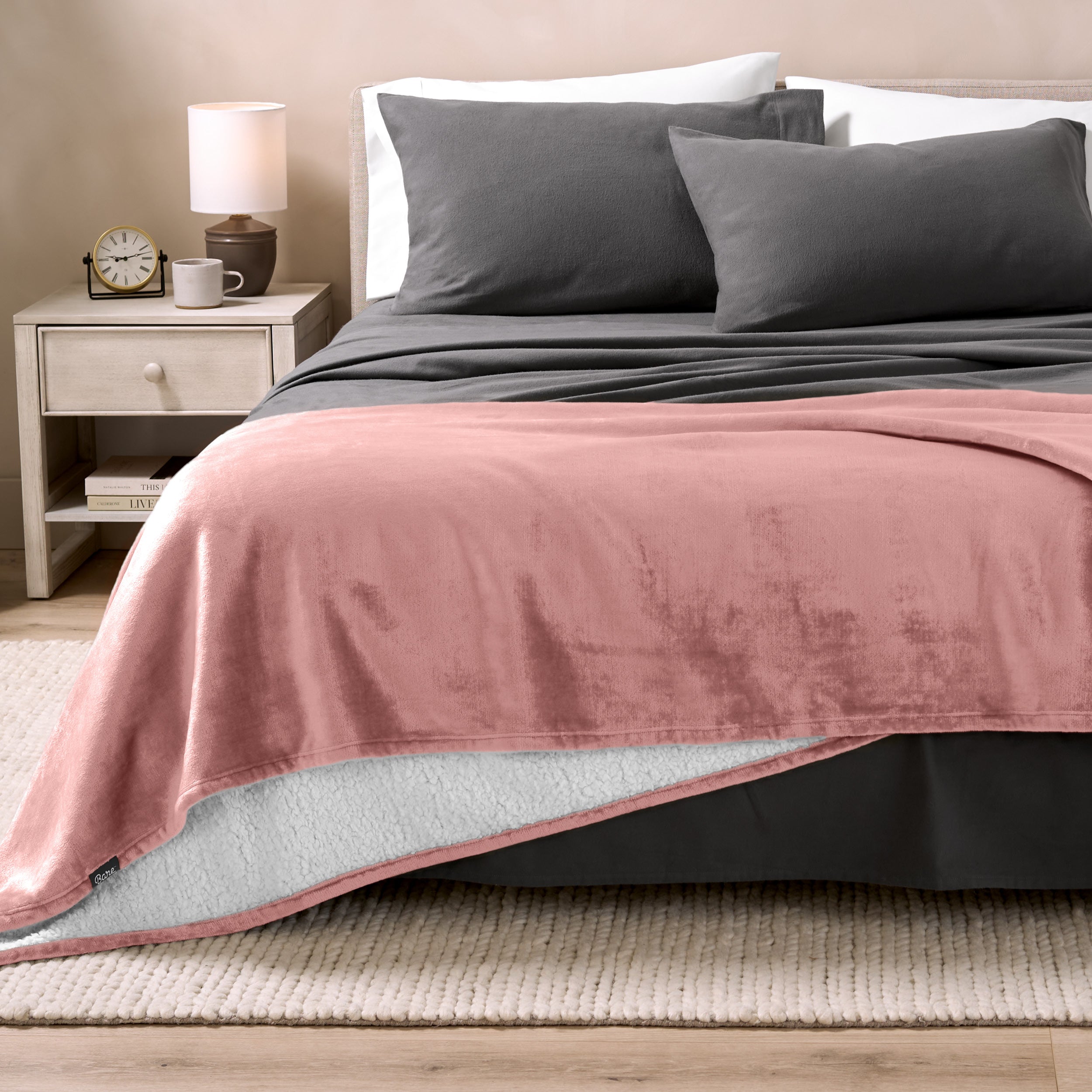 Sherpa Blanket laying on a bed folded over itself part way