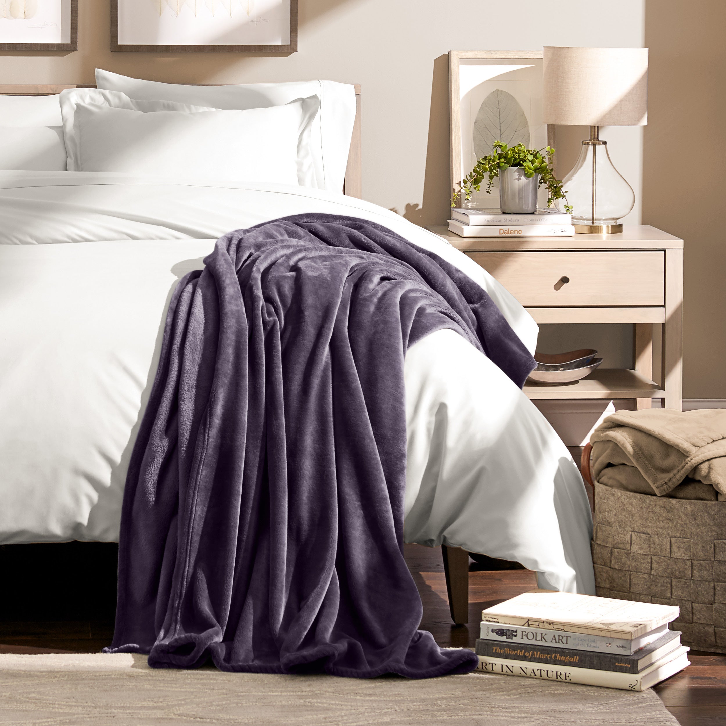 Microplush blanket laid out over a bed and folded back over itself
