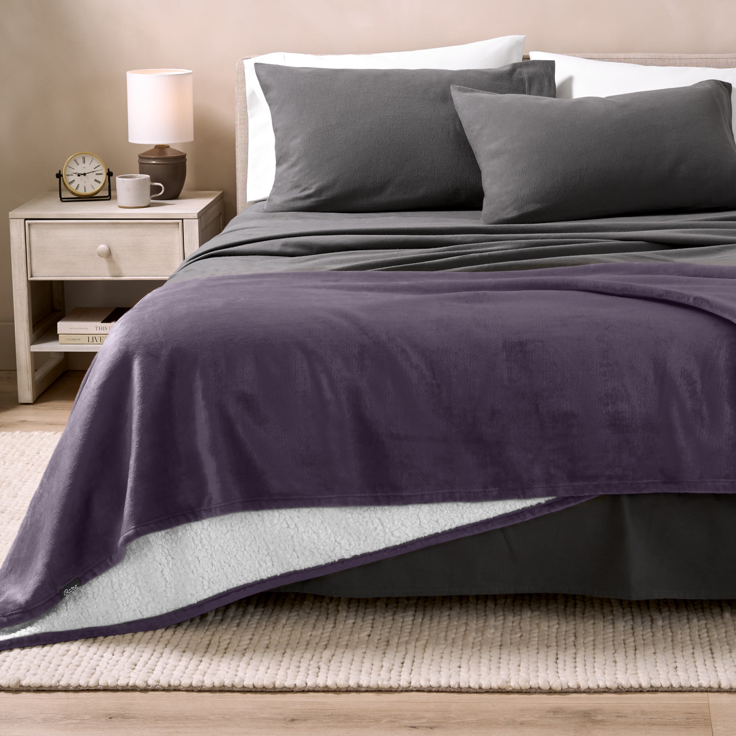 Sherpa Blanket laying on a bed folded over itself part way