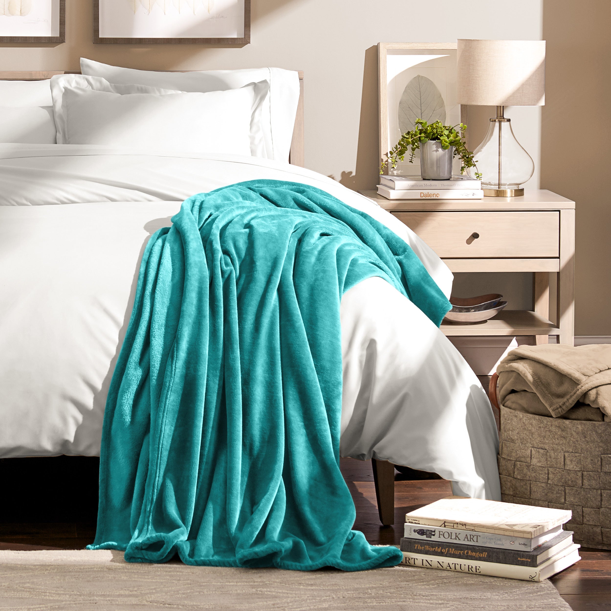 Microplush blanket laid out over a bed and folded back over itself