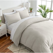 Angled view of bed with a duvet cover folded over on itself