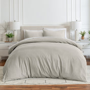 Relaxing room scene with a duvet cover laid out over the bed