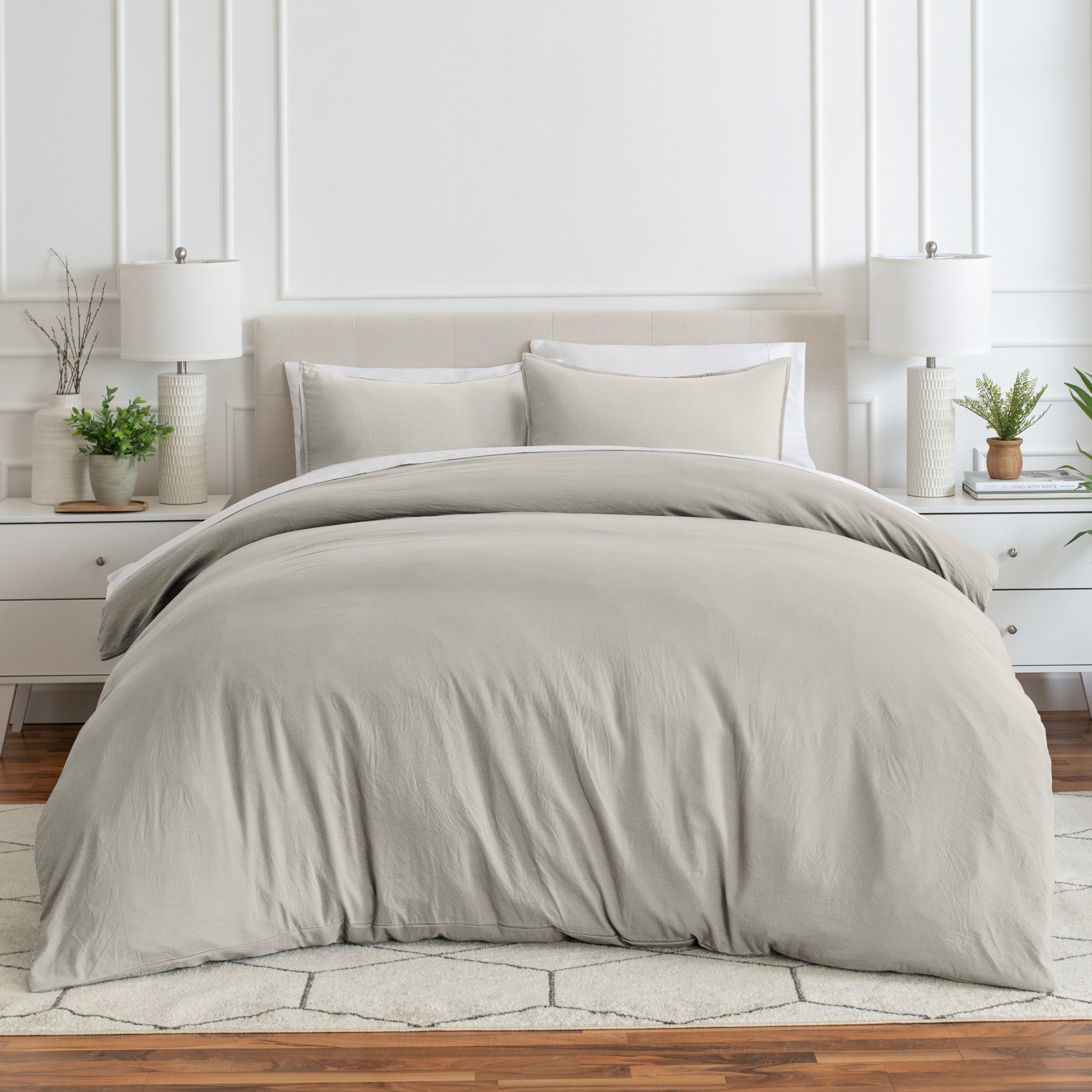 Relaxing room scene with a duvet cover laid out over the bed