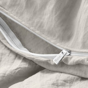 Close up of the zipper on the duvet cover partially opened
