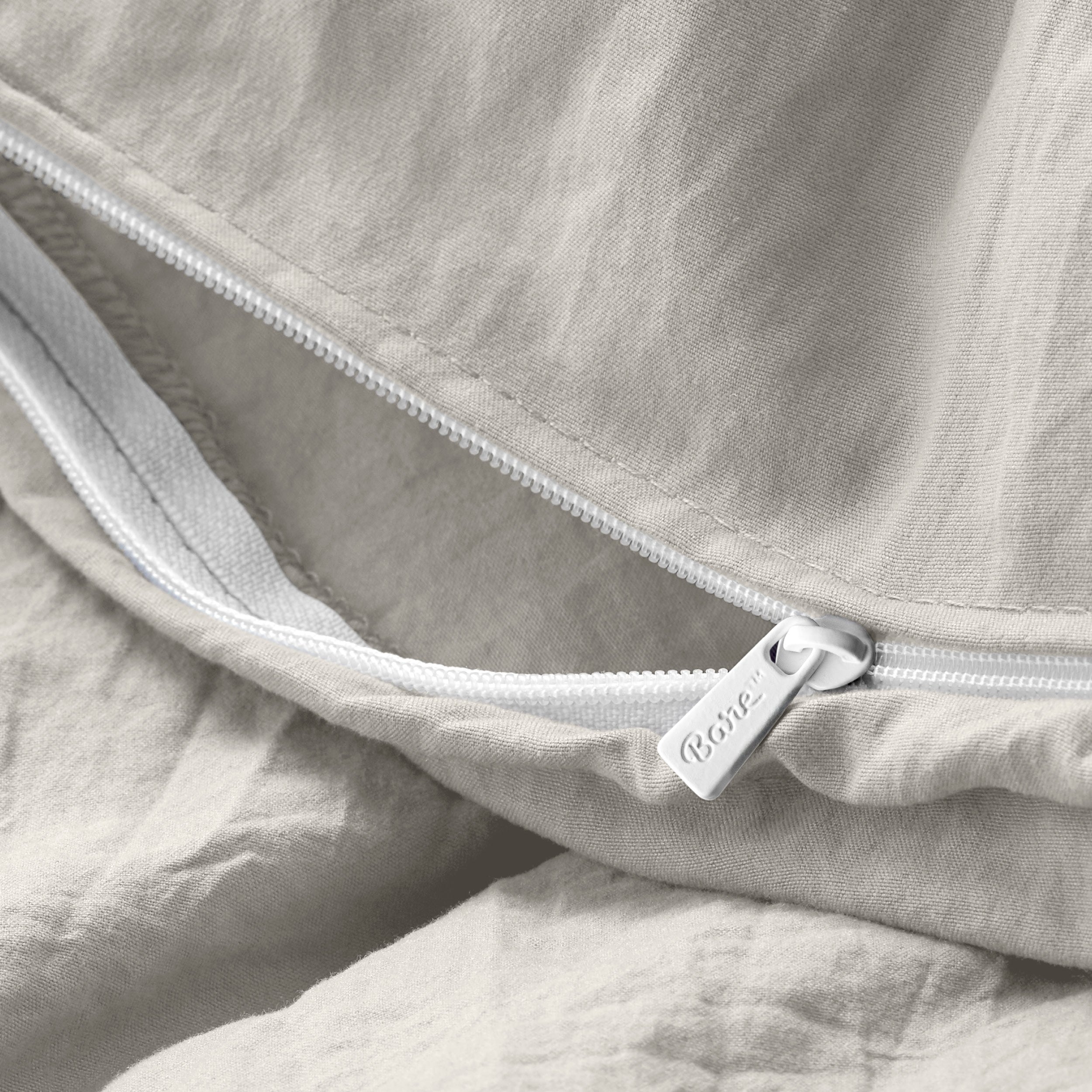 Close up of the zipper on the duvet cover partially opened