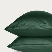 Two bamboo pillowcases on a light gray background