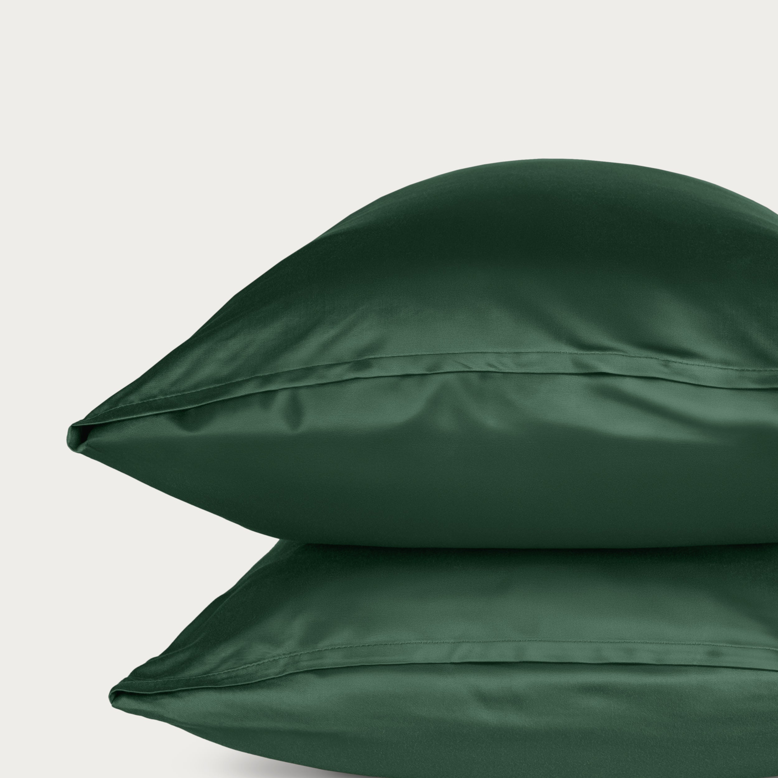 Two bamboo pillowcases on a light gray background