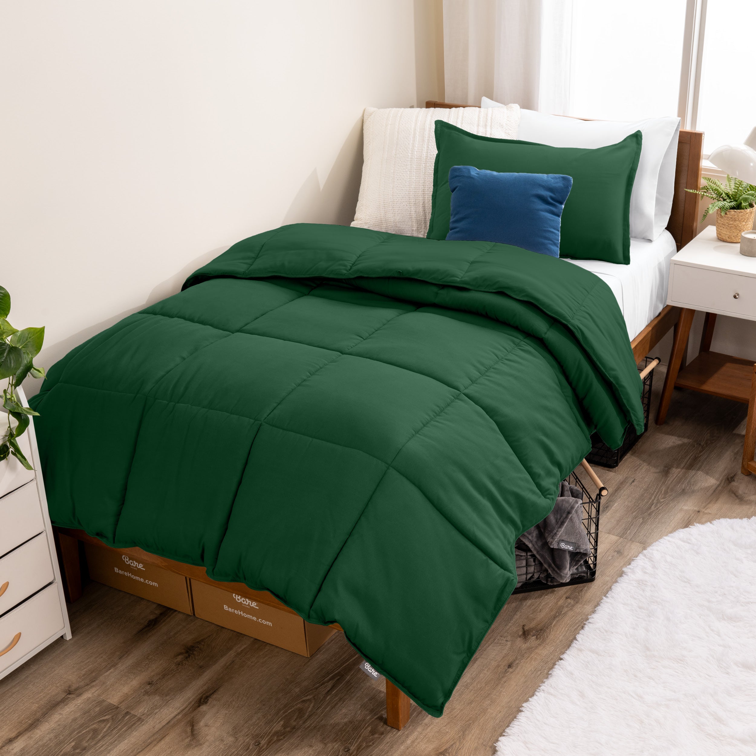 A modern bed with a down alternative comforter set on it
