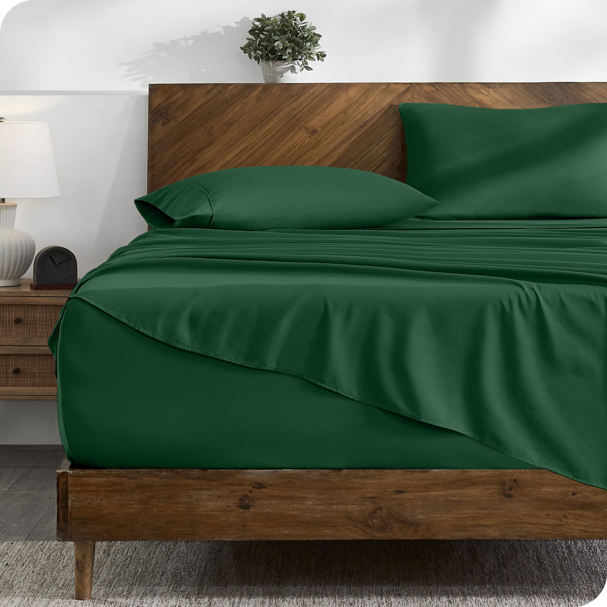 A cozy bedroom with a bed covered in soft microfiber sheets


