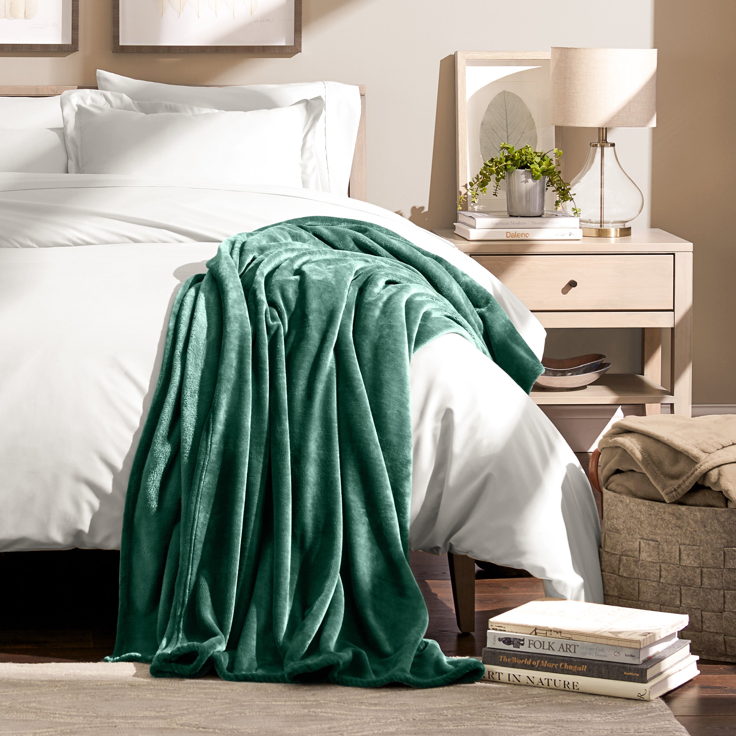 Microplush blanket laid out over a bed and folded back over itself