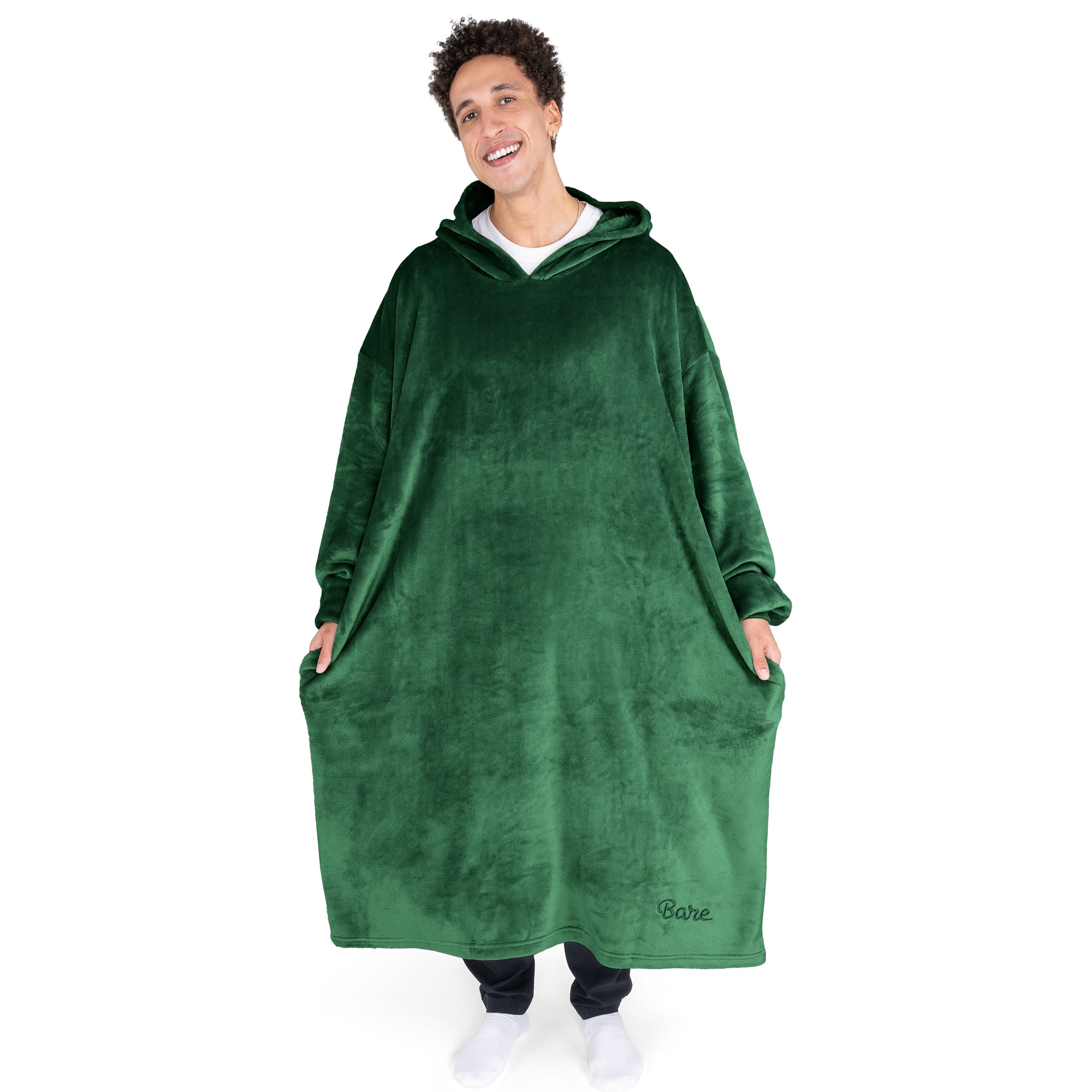 An adult with long microplush wearable blanket on