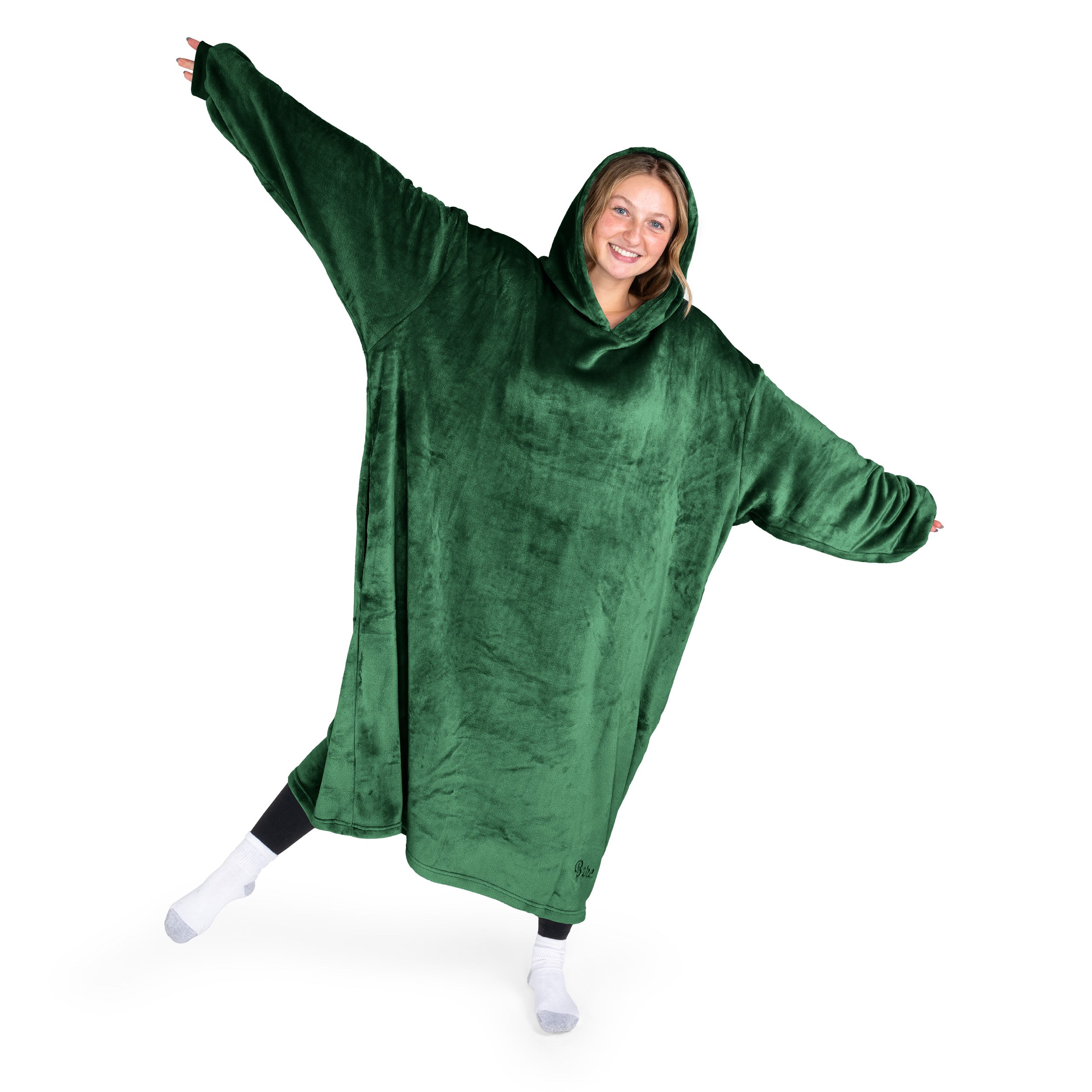 A woman has a hooded wearable blanket on