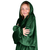 A woman is snuggled up in microplush wearable blanket
