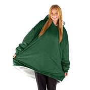 An adult with a sherpa wearable blanket on