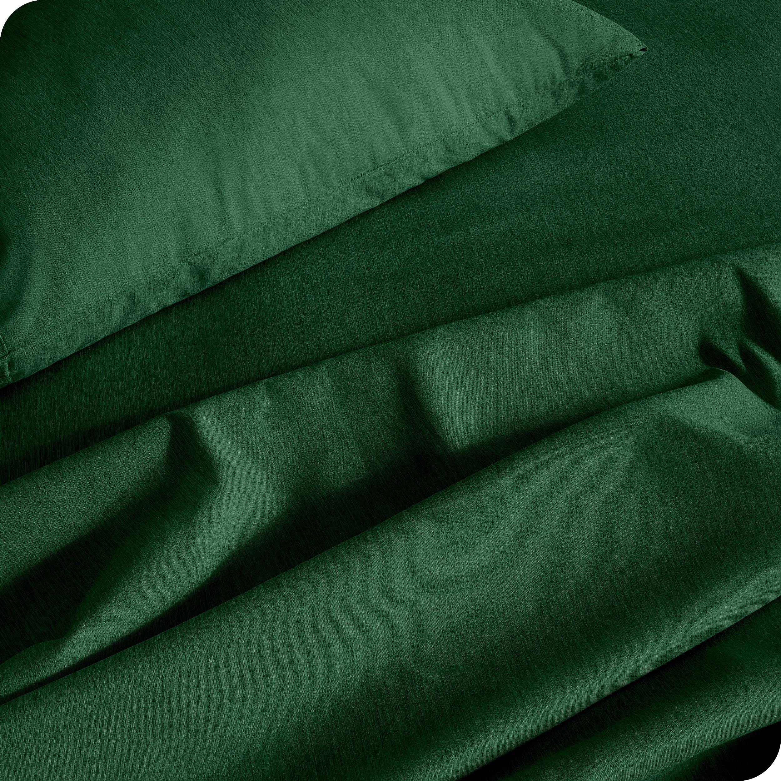 Close up of microfiber sheets and pillowcases on a bed