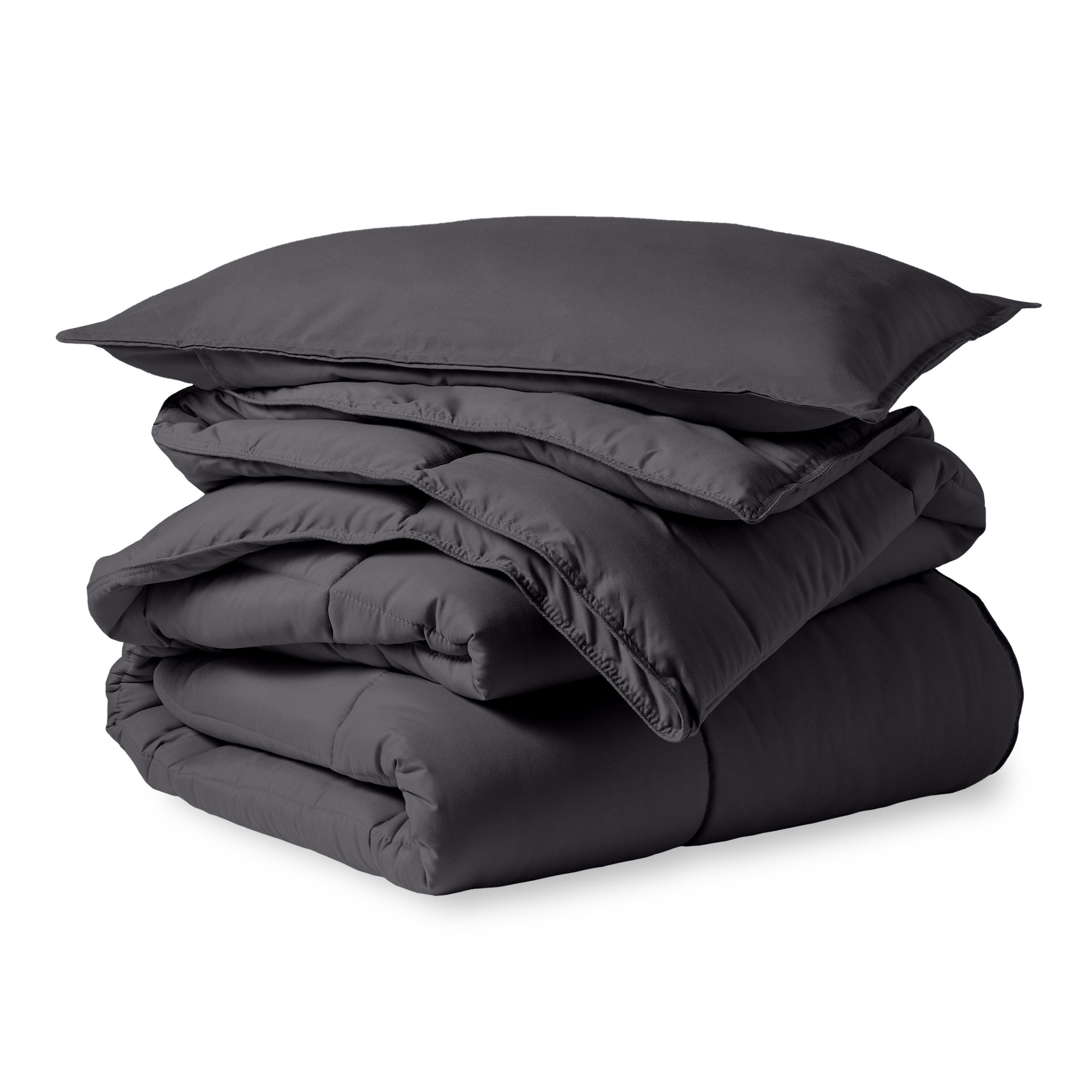 A microfiber comforter folded neatly with a pillow from above