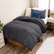 A modern bed with a down alternative comforter set on it