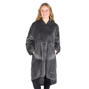 An adult with microplush wearable blanket on