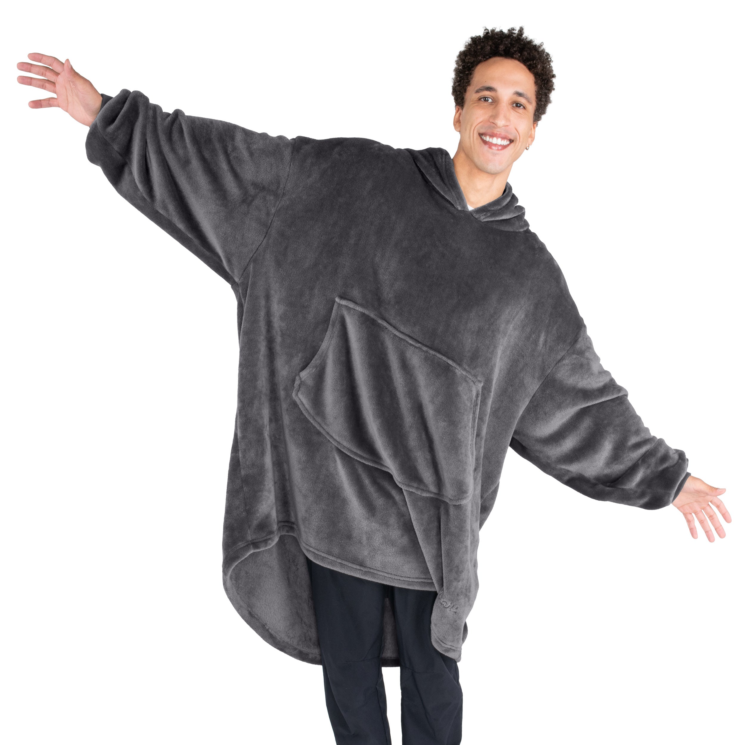 An adult with microplush wearable blanket on