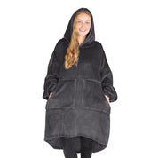 An adult with microplush wearable blanket on