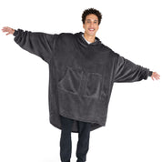 An adult with microplush wearable blanket on