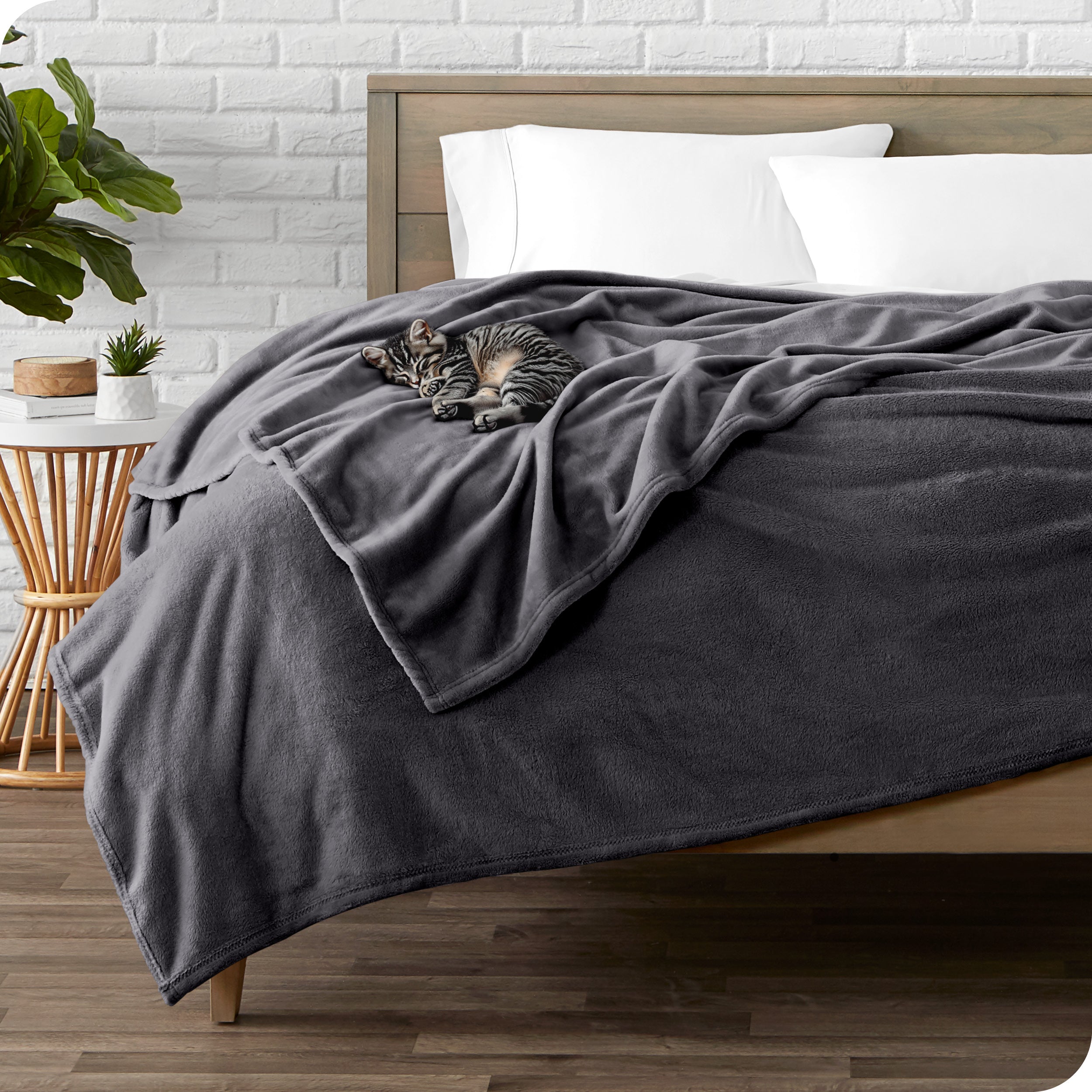 Microplush blanket laid out over a bed and folded back over itself