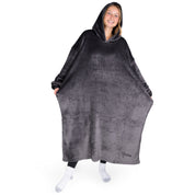 An adult with long microplush wearable blanket on