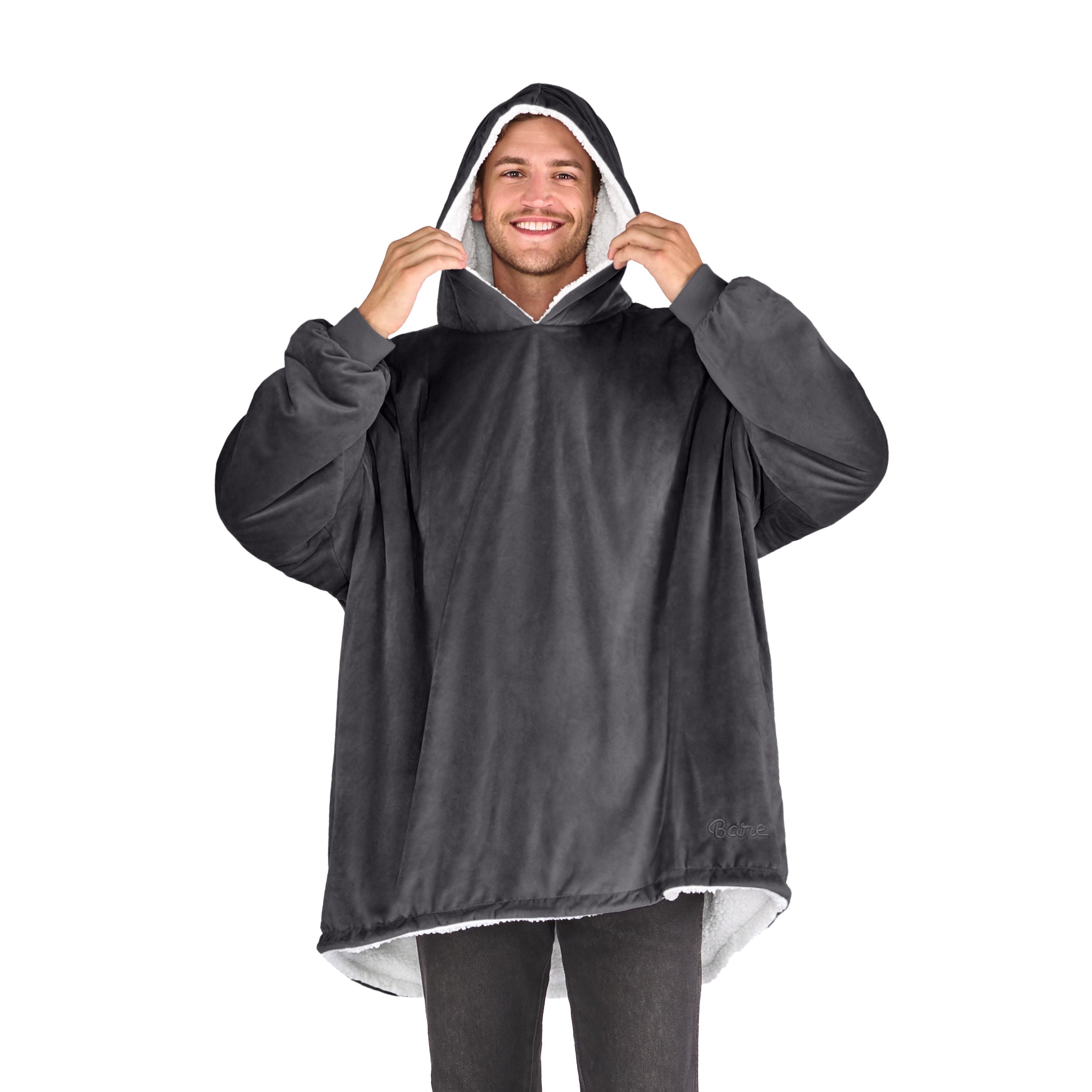 An adult with a sherpa wearable blanket on