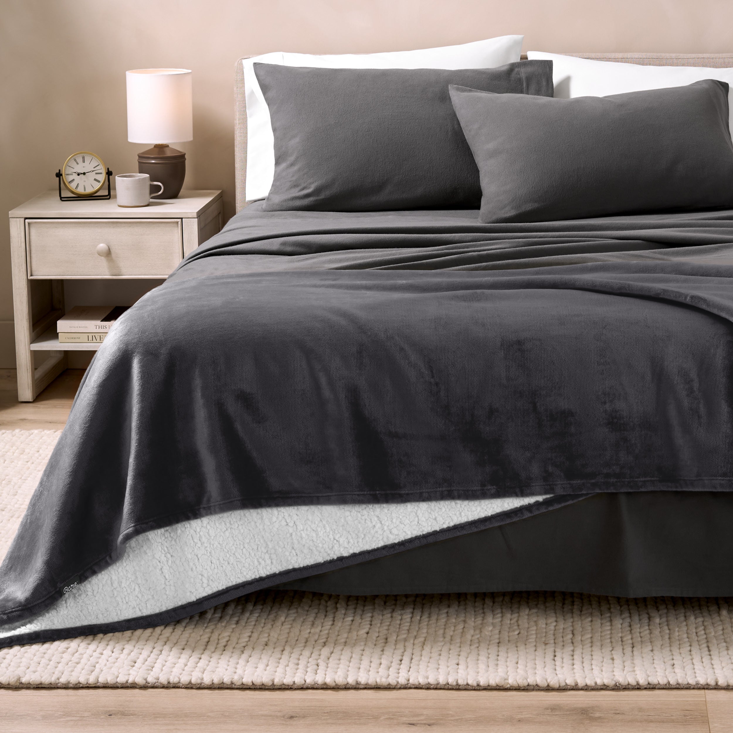 Sherpa Blanket laying on a bed folded over itself part way