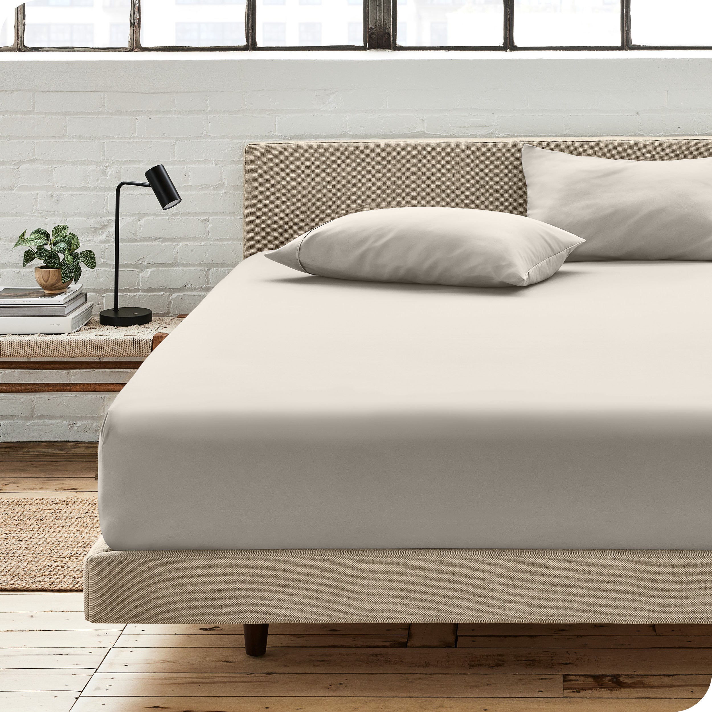 An organic cotton fitted sheet on a mattress