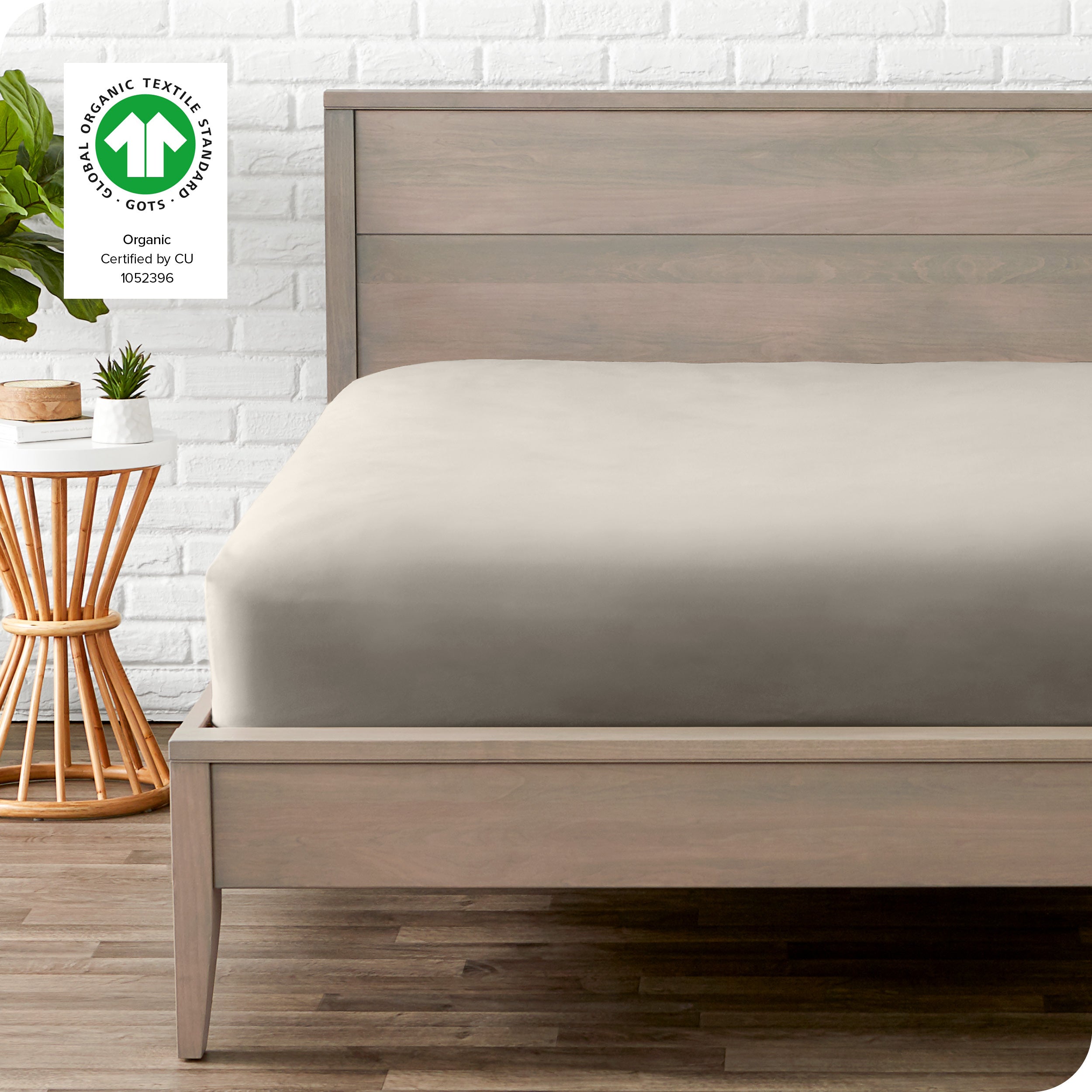 An organic percale bottom sheet on a mattress