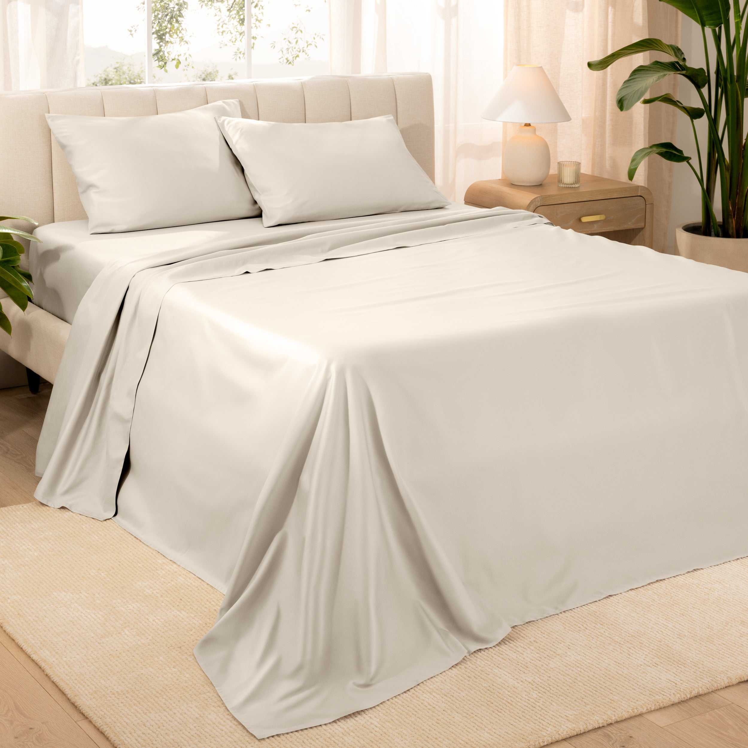 Diagonal view of a decorated room scene with sateen sheets